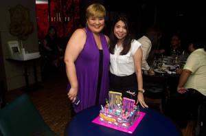 The birthday girls with the birthday cake.